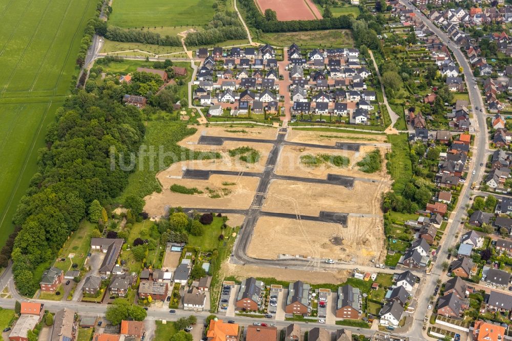 Hamm aus der Vogelperspektive: Baustelle mit Erschließungs - und Aufschüttungs- Arbeiten für den Neubau einer Einfamilienhaussiedlung in Hamm im Bundesland Nordrhein-Westfalen, Deutschland