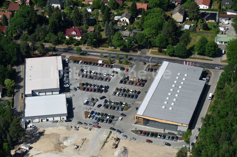 Luftbild Hohen Neuendorf - Baustelle eines neuen Einkaufszentrums und Supermarkt- Filiale von REWE in Hohen Neuendorf im Bundesland Brandenburg