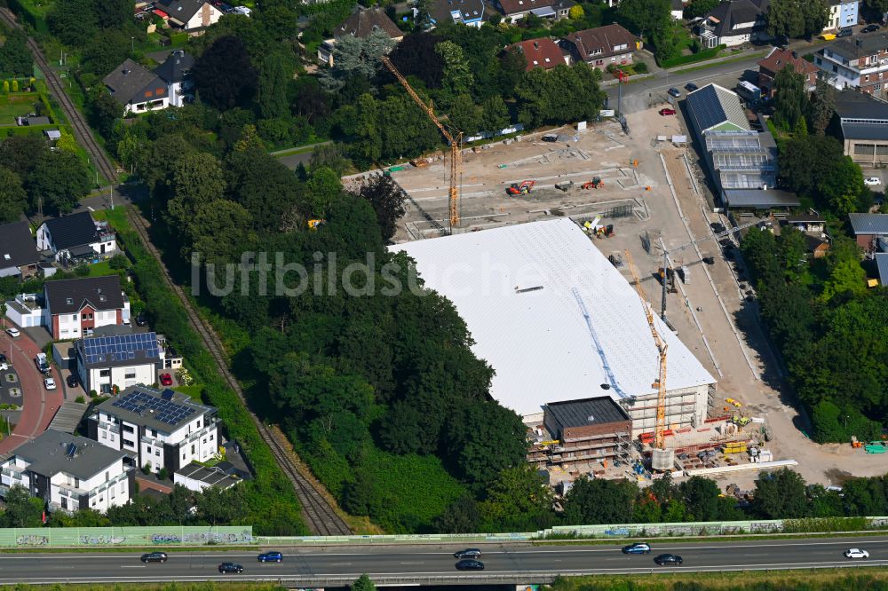 Rheinberg aus der Vogelperspektive: Baustelle zum Neubau des Gebäudekomplexes des Einkaufszentrum für einen Rewe-Markt in Rheinberg im Bundesland Nordrhein-Westfalen, Deutschland