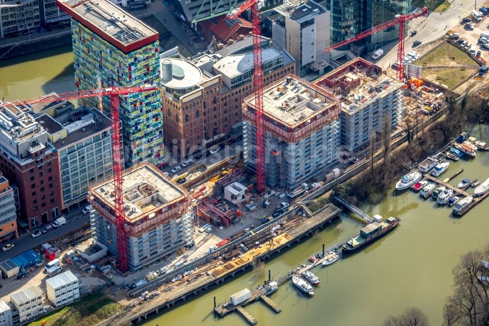 Luftbild Düsseldorf - Baustelle zum Neubau des Hochhaus- Gebäudekomplexes Düsseldorfer Heimathafen in der Speditionstraße in Düsseldorf im Bundesland Nordrhein-Westfalen, Deutschland