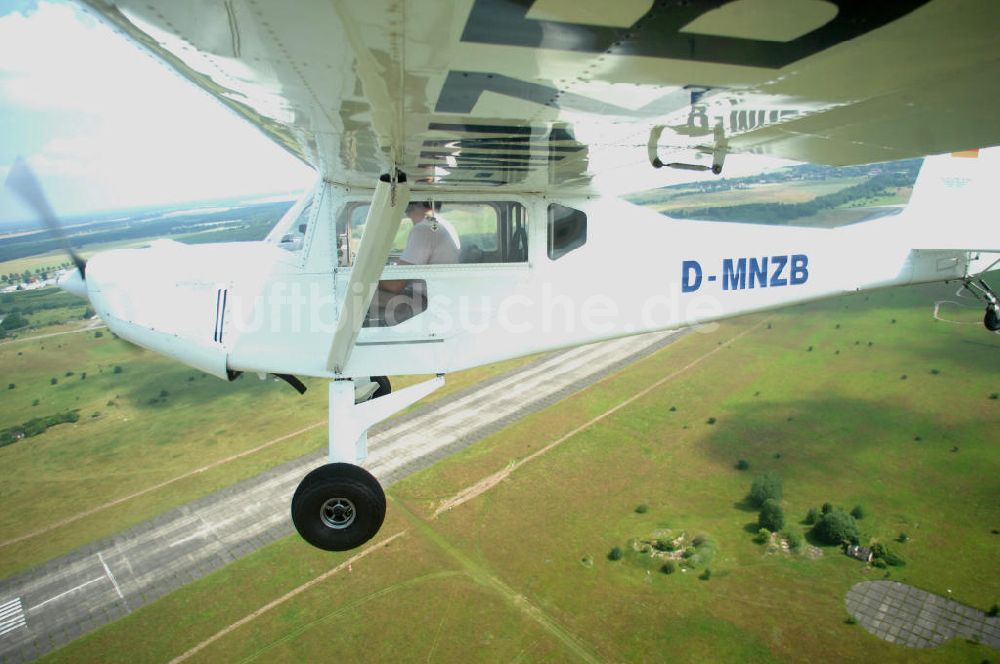 Luftbild Werneuchen - Fisheye-Perspektive auf das Ultraleichtflugzeug WT-01 der Agentur bei einem Flug in der Nähe des Flugplatzes Werneuchen