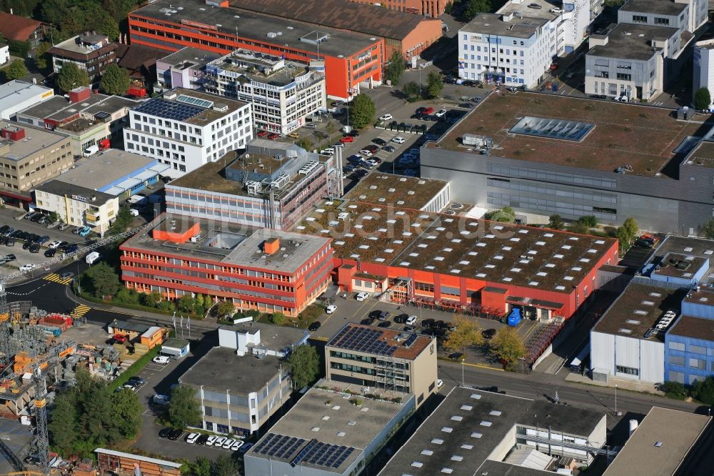 Luftaufnahme Reinach - Gewerbegebiet mit Firmengelände der Flowtec in Reinach in Basel-Landschaft, Schweiz