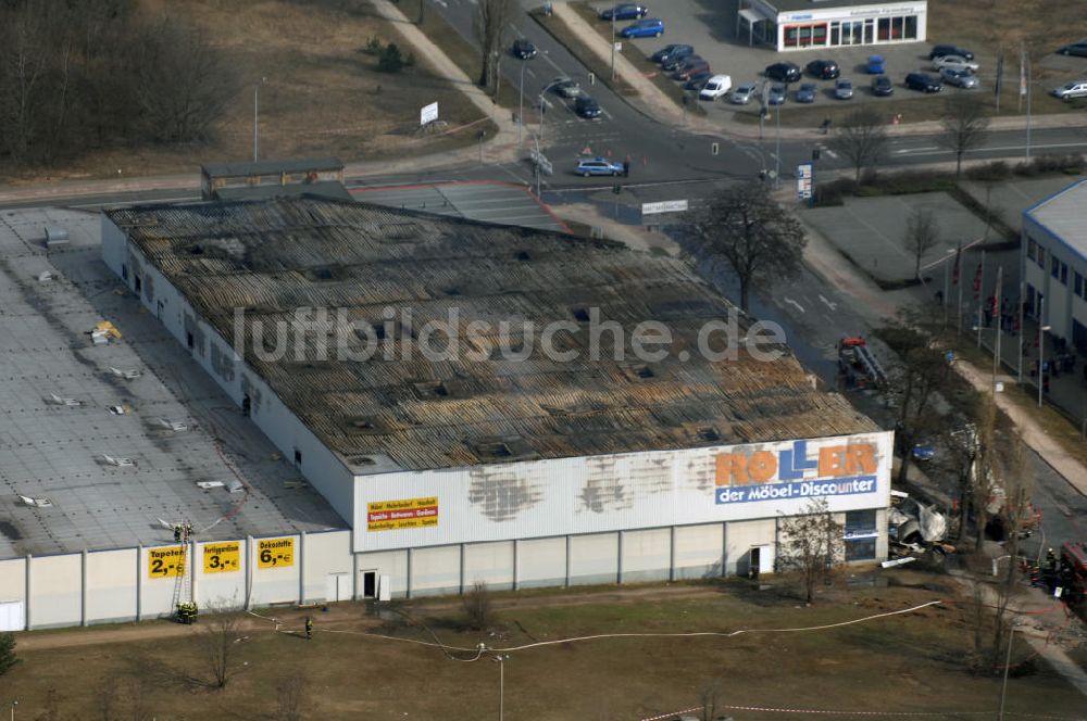 Eisenhüttenstadt aus der Vogelperspektive: Großbrand im Einkaufszentrum / large fire in a shopping center Eisenhüttenstadt