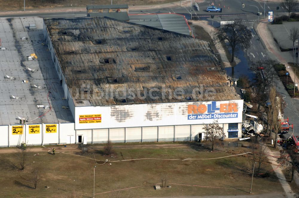 Eisenhüttenstadt aus der Vogelperspektive: Großbrand im Einkaufszentrum / large fire in a shopping center Eisenhüttenstadt