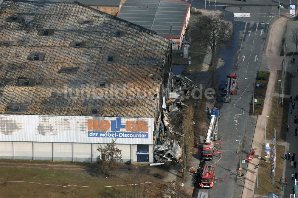 Luftbild Eisenhüttenstadt - Großbrand im Einkaufszentrum / large fire in a shopping center Eisenhüttenstadt