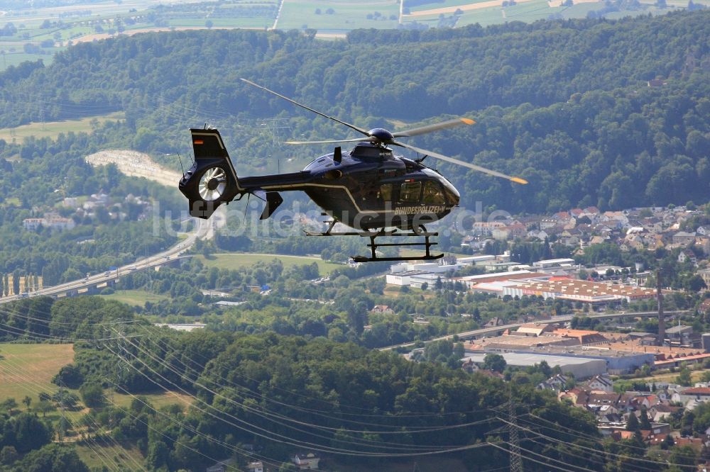 Luftaufnahme Lörrach - Helikopter - Hubschrauber EC 135 der Bundespolizei D-HVBD im Fluge über dem Luftraum in Lörrach im Bundesland Baden-Württemberg