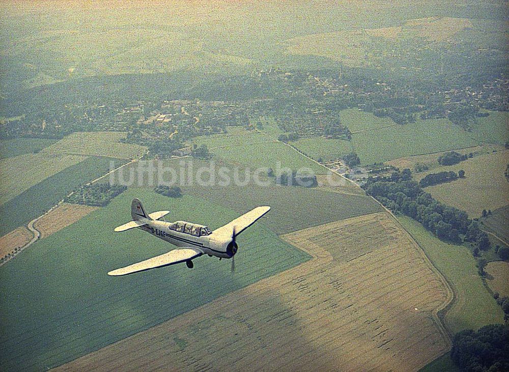 Luftaufnahme Chemnitz - JAK 18 A der Fiedler - Airservice Jahnsdorf über dem Stadtrand und Umgebung von Chemnitz