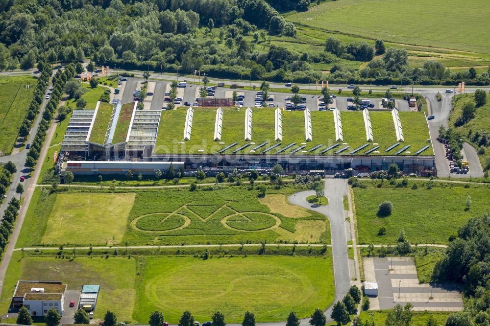 Luftbild Hamm - Ökozentrum Hamm mit einem großen eingemähtem Fahrrad hinter OBI Markt in Hamm im Bundesland Nordrhein-Westfalen