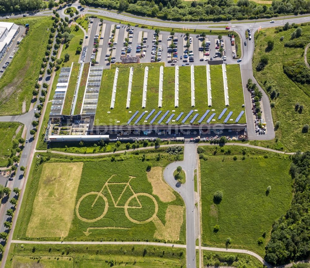 Luftbild Hamm - Ökozentrum Hamm mit einem großen eingemähtem Fahrrad hinter OBI Markt in Hamm im Bundesland Nordrhein-Westfalen