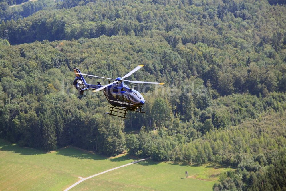 Rheinfelden (Baden) aus der Vogelperspektive: Polizeihubschrauber Helikopter - Hubschrauber EC 135 der Bundespolizei D-HVBD im Fluge über dem Luftraum in Rheinfelden (Baden) im Bundesland Baden-Württemberg