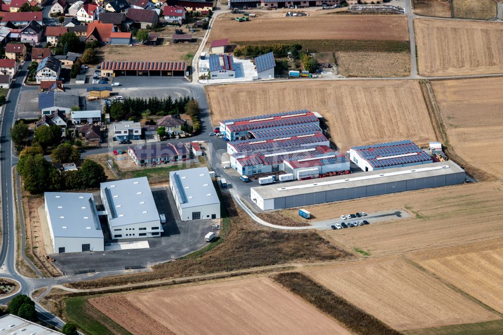 Steinfeld aus der Vogelperspektive: Werksgelände der SCHMELZMETALL Deutschland GmbH und der INHATEC GmbH & Co. KG an der Raiffeisenstraße im Ortsteil Hausen in Steinfeld im Bundesland Bayern, Deutschland