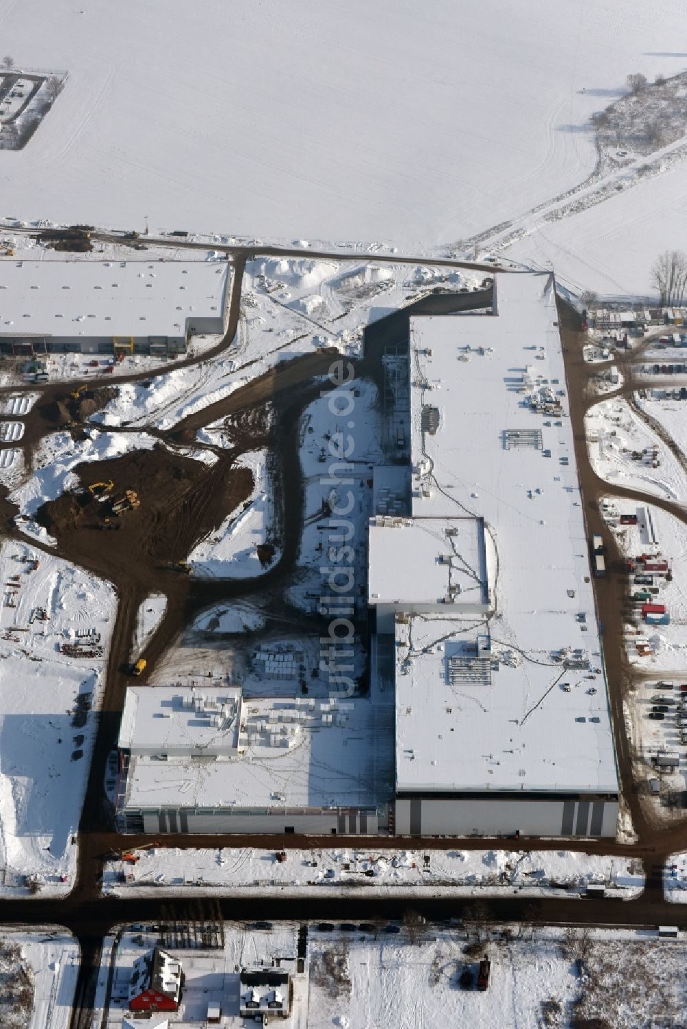 Berlin von oben - Winterluftbild Baustelle zum Neubau eines Möbelhauses der Porta-Gruppe in Mahlsdorf in Berlin