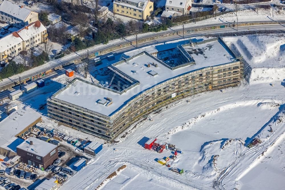 Dortmund aus der Vogelperspektive: Winterluftbild Baustelle zum Neubau eines Wohnhauses Wohnen am Hombrucher Bogen im Ortsteil Zechenplatz in Dortmund im Bundesland Nordrhein-Westfalen, Deutschland