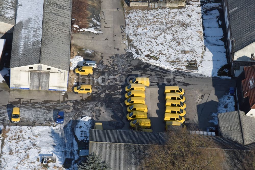 Werneuchen von oben - Winterluftbild Gebäudekomplex und Logistikzentrum auf dem Gelände der Deutschen Post - DHL an der Freienwalder Straße in Werneuchen im Bundesland Brandenburg