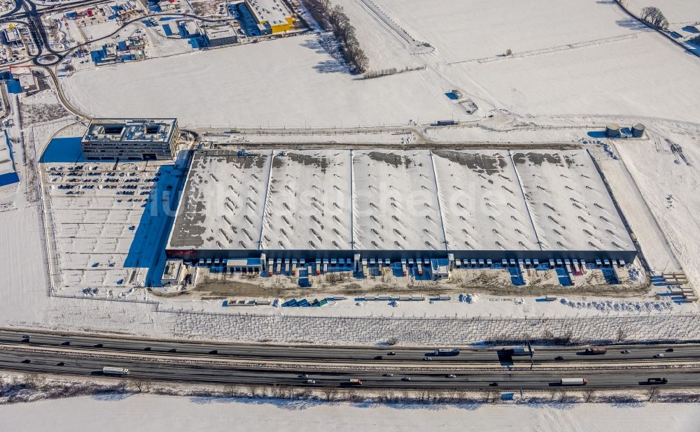 Luftbild Kamen - Winterluftbild Logistikzentrum der Woolworth GmbH in Kamen im Bundesland Nordrhein-Westfalen, Deutschland